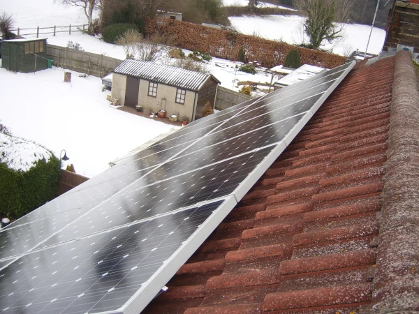Solar panels installed on pitched roof in winter conditions